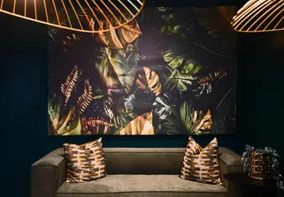 a large painting on a wall above a couch with pillows at Luxery Gem in Stellenbosch in Stellenbosch