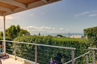 a view of the ocean from the balcony of a house at Dieu Donne in Hermanus