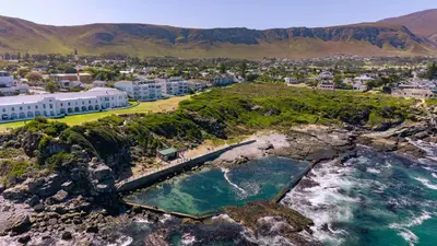 an aerial view of a beach and the ocean at Seaside Serenity: Tranquil Oceanview Retreat in Hermanus