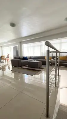 a living room with a couch and a table at The Other House - Cape Town in Cape Town