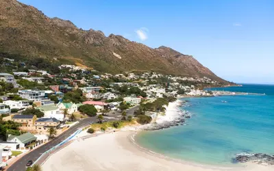 an aerial view of a beach with houses and the ocean at Le Gaulois Luxury Apartments, sleeps 2, Sea Views in Gordonʼs Bay
