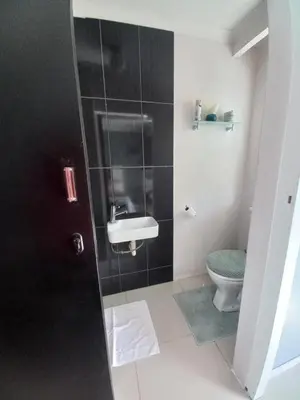 a bathroom with a sink and a toilet at Freys 1 in Cape Town