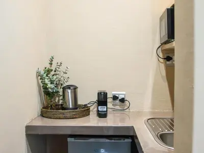 a kitchen counter with a coffee maker and a sink at Nooitgedacht Guest Farm Cottages in Kayamnandi