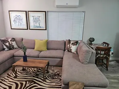 a living room with a couch and a table at At 37 Masters Way in Brandwacht