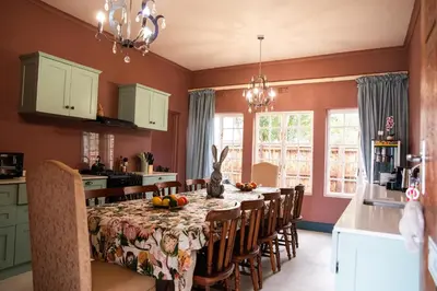 a kitchen with a table and chairs in a kitchen at Greyton Toad Hall Historic Private House in Central Greyton in Greyton