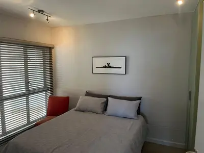 a bedroom with a bed and a window at 502 Hibernian Towers in Cape Town