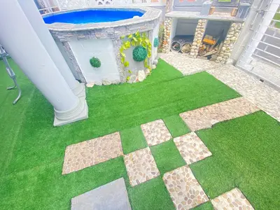 an overhead view of a backyard with a pool and grass at Kwaaamiii in Cape Town
