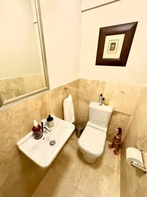 a bathroom with a toilet and a sink at 74 on Marine - Apartment 303 in Hermanus