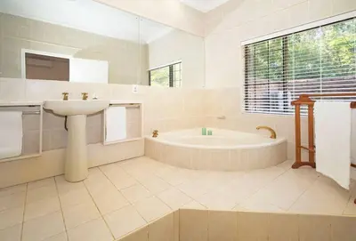 a bathroom with a sink and a bath tub at The Oasis of Stellenbosch in Stellenbosch