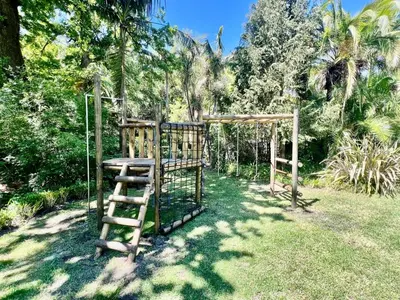 a wooden structure in the grass in a yard at The Oasis of Stellenbosch in Stellenbosch