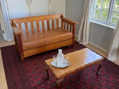a living room with a chair and a coffee table at Bordeaux 45 in Cape Town