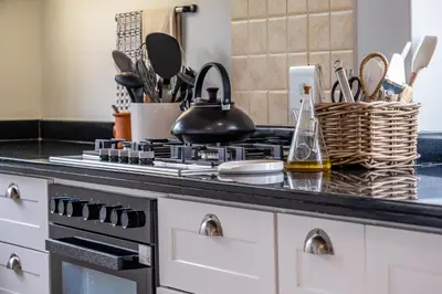 a kitchen counter with a stove top oven at 3 on Vermont in Hermanus