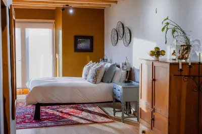 a bedroom with a bed and a dresser in it at Berghuis - Mountain Hideaway in Wolseley