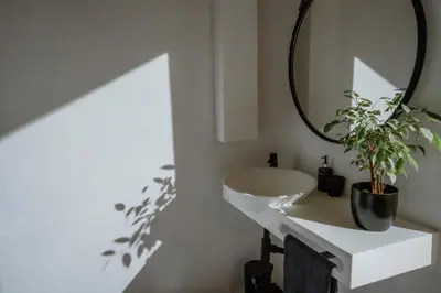 a bathroom with a white sink and a mirror at Berghuis - Mountain Hideaway in Wolseley