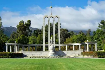 a monument in front of a building with a statue at Franschhoek - A Sensory Escape in Franschhoek