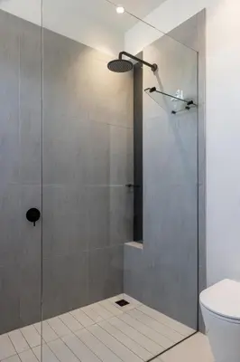 a shower with a glass door in a bathroom at Benguela Cove - Milk and Honey in Hermanus