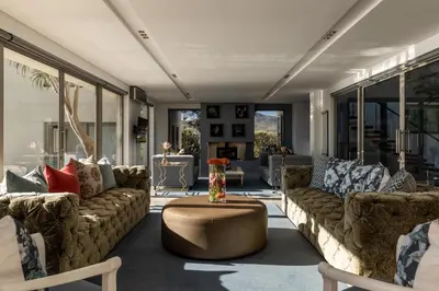 a living room with couches and a coffee table at Benguela Cove - Lavender Dreams in Hermanus