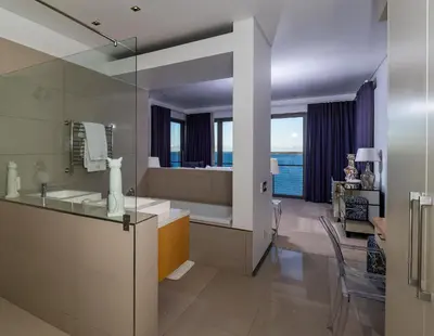 a bathroom with a tub and a sink and a window at Benguela Cove - Lavender Dreams in Hermanus