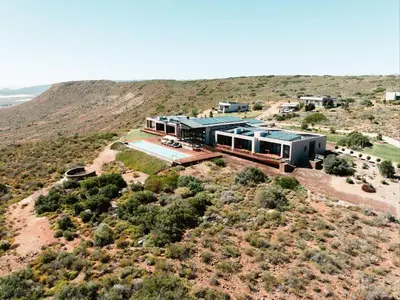 an aerial view of a house in the desert at Khanyisa Mountain Lodge in Robertson