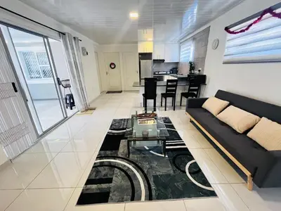 a living room with a couch and a table at The MK House in Cape Town