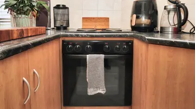 a kitchen with an oven with a towel on it at Corner View in Paarl