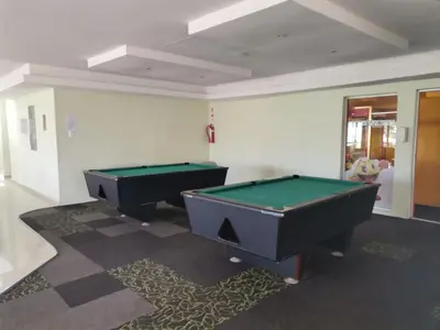 two pool tables sitting in a room with at Hermanus Beach Club 143 in Hermanus