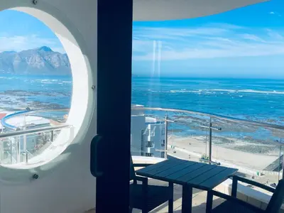 a view of the ocean from a room with a table at Hibernian 10.02 in Cape Town