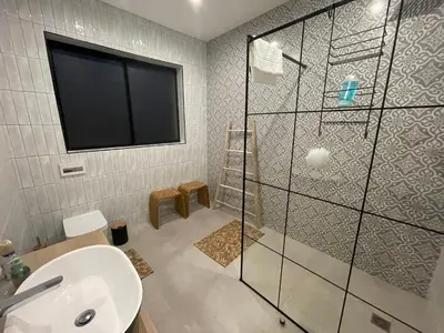 a bathroom with a shower and a sink at 29nTanglewood cr, Sunset Links residential Estate in Cape Town
