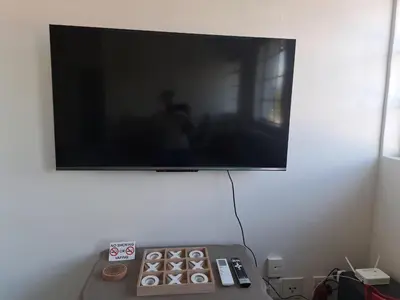 a flat screen tv hanging on a wall at The Muscadel - Paarl - Self Catering Apartment in Paarl