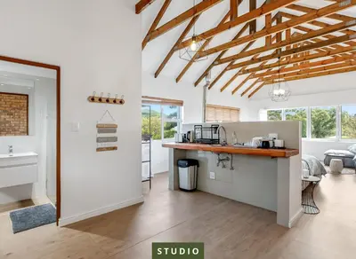 a kitchen with a counter and a sink in a room at Kiefern Haus Studio Apartment in Cape Town
