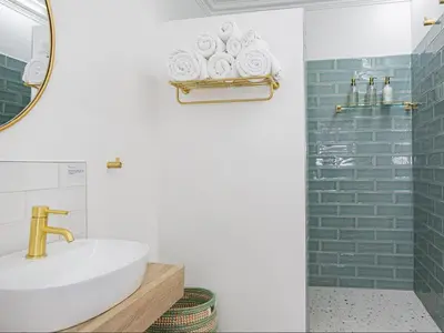 a bathroom with a sink and a mirror at La Dolce Vita Gordon’s Bay in Gordonʼs Bay