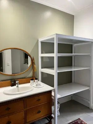 a bathroom with a sink and a mirror at Somerset West All Stay 3 in Somerset West