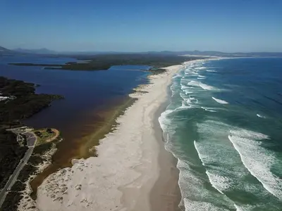 an aerial view of a beach and the ocean at Inn 201 in Hermanus