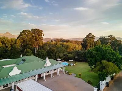 an aerial view of a house with a green roof at La Felicita Boutique Self Catering Villas in Somerset West