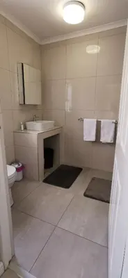 a bathroom with a sink and a toilet at Mila's at Panorama in Panorama
