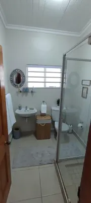 a bathroom with a toilet and a sink and a shower at Lasai Accommodation in Worcester