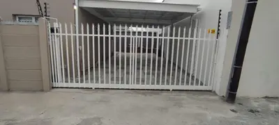 a white gate in a garage with a door at Lasai Accommodation in Worcester
