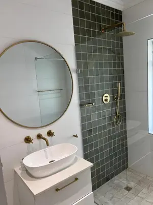 a bathroom with a sink and a mirror at Chasselas Self Catering in Cape Town
