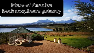 a book now dream gardenery with a view of a lake at Piece of Paradise in Cape Town