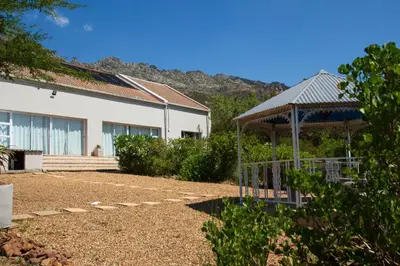 a house with a gazebo and a building at Piece of Paradise in Cape Town