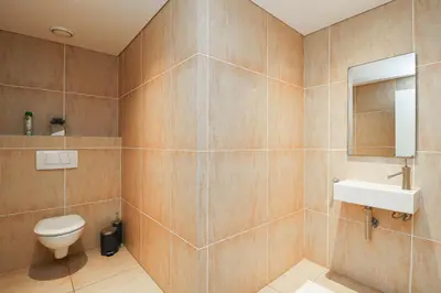 a bathroom with a toilet and a sink at Ocean View 304 Luxury Self Catering Apartment Strand Western Cape South Africa in Cape Town