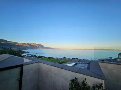 a view of a body of water from a building at Central - Whale Watching Paradise -Self check in in Hermanus