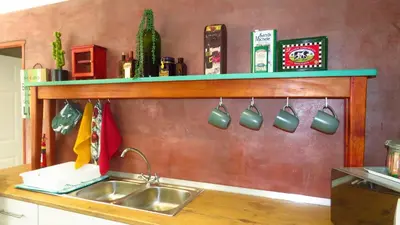 a kitchen sink with a green shelf above it at Sonvanger 3 in Paarl