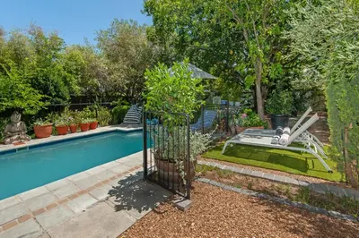 a swimming pool in a yard with a swimming pool at Franschhoek villa in Franschhoek