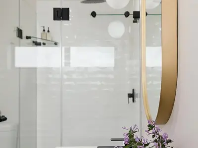 a bathroom with a shower with a glass door at Yonder Hill Accommodation in Raithby
