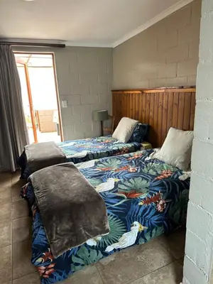 two beds sitting next to each other in a bedroom at The Jack at Marnas Self Catering Accommodation in Cape Town