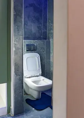 a bathroom with a white toilet in a room at FB-Canatal Luxury Apartments in Cape Town