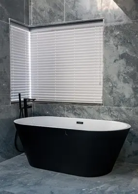 a bath tub in a bathroom with a window at FB-Canatal Luxury Apartments in Cape Town