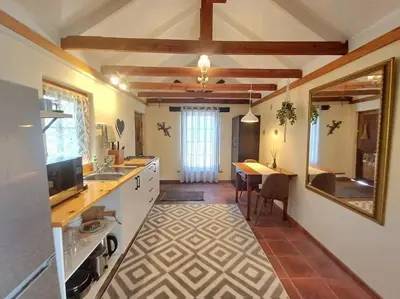 a large kitchen with a table and a dining room at Garden City Summer in Cape Town