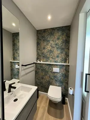 a bathroom with a sink and a toilet at Swanemeer Apartments in Cape Town